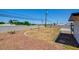 View of a spacious backyard area, complete with gravel, potential landscaping, and ample space for outdoor enjoyment at 304 Elliott Ave, Las Vegas, NV 89106