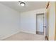 This bedroom features neutral carpet, white walls, and closet at 304 Elliott Ave, Las Vegas, NV 89106