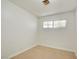 This bedroom features neutral carpet, white walls, and a window at 304 Elliott Ave, Las Vegas, NV 89106
