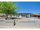 Charming single-story home featuring stone accents, a covered carport, and a well-maintained front yard at 304 Elliott Ave, Las Vegas, NV 89106