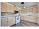 Well-lit kitchen with white appliances, ample countertop space, and beautiful tile backsplash at 304 Elliott Ave, Las Vegas, NV 89106
