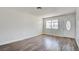 This spacious living room offers plenty of room, new floors, and a front-facing window at 304 Elliott Ave, Las Vegas, NV 89106