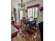 Dining room with a wood table, chairs, and laminate flooring at 3400 Cabana Dr # 1061, Las Vegas, NV 89122