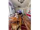 Open dining area with wood table, chairs, leading to a living room and kitchen at 3400 Cabana Dr # 1061, Las Vegas, NV 89122