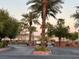 Gated entrance with palm trees and well-maintained landscaping at 3400 Cabana Dr # 1061, Las Vegas, NV 89122