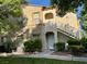 Exterior view of a two-story residence with staircase and well-manicured lawn at 3400 Cabana Dr # 1061, Las Vegas, NV 89122