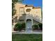Exterior view of a two-story residence with staircase and well-manicured lawn at 3400 Cabana Dr # 1061, Las Vegas, NV 89122