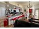 Kitchen with white cabinets, granite countertops, breakfast bar, and modern appliances at 3400 Cabana Dr # 1061, Las Vegas, NV 89122