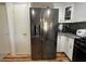 Stainless steel french door refrigerator in kitchen with white cabinets and appliances at 3400 Cabana Dr # 1061, Las Vegas, NV 89122