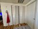 Hallway with white folding closet doors and neutral decor at 3400 Cabana Dr # 1061, Las Vegas, NV 89122
