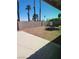 Private backyard with desert landscaping, block wall, and concrete patio at 4128 Annie Oakley Dr, Las Vegas, NV 89121