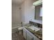 Bathroom featuring a stylish vanity with elegant countertop and a shower-tub combination at 4128 Annie Oakley Dr, Las Vegas, NV 89121