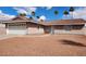 Charming single-story home with a two-car garage and well-maintained front yard and attractive desert landscaping at 4128 Annie Oakley Dr, Las Vegas, NV 89121