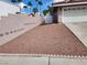 View of a xeriscaped front yard with a block wall and white gate at 4128 Annie Oakley Dr, Las Vegas, NV 89121