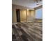 Spacious living room featuring stylish wood-look floors and ample natural light at 4128 Annie Oakley Dr, Las Vegas, NV 89121