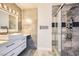 Stylish bathroom with a glass shower, double vanity, and modern fixtures at 4347 S Mojave Rd, Las Vegas, NV 89121