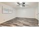 Bright bedroom featuring wood floors, a ceiling fan, a window, and neutral-colored walls at 4347 S Mojave Rd, Las Vegas, NV 89121