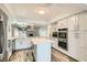 Modern kitchen with stainless steel appliances, an island, and updated countertops at 4347 S Mojave Rd, Las Vegas, NV 89121