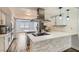 Renovated kitchen with stainless steel appliances and breakfast bar at 4347 S Mojave Rd, Las Vegas, NV 89121