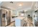 Bright kitchen features stainless steel appliances, island, and opens to an airy living space at 4347 S Mojave Rd, Las Vegas, NV 89121