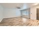 Living room boasts wood floors, lots of space, natural light, and a ceiling fan at 4347 S Mojave Rd, Las Vegas, NV 89121