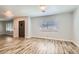 Living room with wood floors, bright natural light and a view into another living space at 4347 S Mojave Rd, Las Vegas, NV 89121