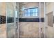 Beautiful shower features upgraded showerhead and stylish tile surround at 4347 S Mojave Rd, Las Vegas, NV 89121