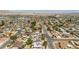 Wide aerial shot of a neighborhood, showcasing residential homes and the surrounding landscape at 4394 El Campana Way, Las Vegas, NV 89121