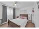 Well-lit bedroom features a large window, mirror, and shelf space at 4394 El Campana Way, Las Vegas, NV 89121