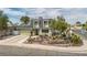 Charming two-story home with a well-maintained lawn and a spacious driveway leading to an attached garage at 4394 El Campana Way, Las Vegas, NV 89121