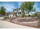 Charming two-story home with a well-maintained lawn and inviting front yard landscaping at 4394 El Campana Way, Las Vegas, NV 89121