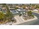 Charming two-story home showcasing well-manicured landscaping, a driveway, and multiple solar panels on the roof at 4394 El Campana Way, Las Vegas, NV 89121