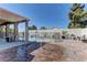 Relaxing backyard featuring a covered patio, water feature, and comfortable seating, ideal for outdoor living at 5629 Portage Lake Ct, Las Vegas, NV 89130