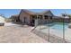 Spacious backyard with a pool, water feature, and paved patio, perfect for outdoor activities and relaxation at 5629 Portage Lake Ct, Las Vegas, NV 89130