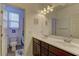 Well-lit bathroom with double sinks and a shower/tub combo at 5629 Portage Lake Ct, Las Vegas, NV 89130