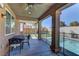 Charming covered patio featuring comfortable seating, offering a serene outdoor space with pool views at 5629 Portage Lake Ct, Las Vegas, NV 89130