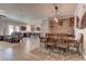 Open-concept living space with dining area, island seating, and stylish furniture at 5629 Portage Lake Ct, Las Vegas, NV 89130