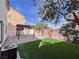 This backyard has a covered patio and artificial turf, perfect for outdoor entertaining at 5664 Dawn Falls St, Las Vegas, NV 89148