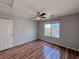 Bedroom with hardwood floors and ceiling fan at 5664 Dawn Falls St, Las Vegas, NV 89148