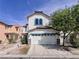 Charming two-story home featuring a well-manicured front yard and a two-car garage at 5664 Dawn Falls St, Las Vegas, NV 89148