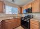 Modern kitchen equipped with stainless steel appliances and updated countertops at 5664 Dawn Falls St, Las Vegas, NV 89148