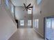 Bright and airy living room with high ceilings and a modern ceiling fan at 5664 Dawn Falls St, Las Vegas, NV 89148