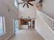 Bright living room featuring a staircase, high ceilings, and an open-concept design at 5664 Dawn Falls St, Las Vegas, NV 89148