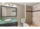 Bathroom featuring decorative glass sink, and tiled walk-in shower at 5855 Valley Dr # 1080, North Las Vegas, NV 89031