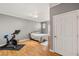Bright bedroom featuring hardwood floors, exercise equipment, and ample space at 5855 Valley Dr # 1080, North Las Vegas, NV 89031