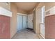 Inviting entryway with sliding glass door, house number, and covered space at 5855 Valley Dr # 1080, North Las Vegas, NV 89031