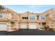 Exterior view of townhomes with red tile roofs and individual garages at 5855 Valley Dr # 1080, North Las Vegas, NV 89031