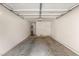 Empty 2-car garage with garage door opener and water heater at 5855 Valley Dr # 1080, North Las Vegas, NV 89031