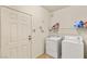 Laundry room with included washer, dryer, and shelving at 5855 Valley Dr # 1080, North Las Vegas, NV 89031