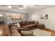 Open-concept living room featuring a comfortable sectional sofa and hardwood floors at 5855 Valley Dr # 1080, North Las Vegas, NV 89031